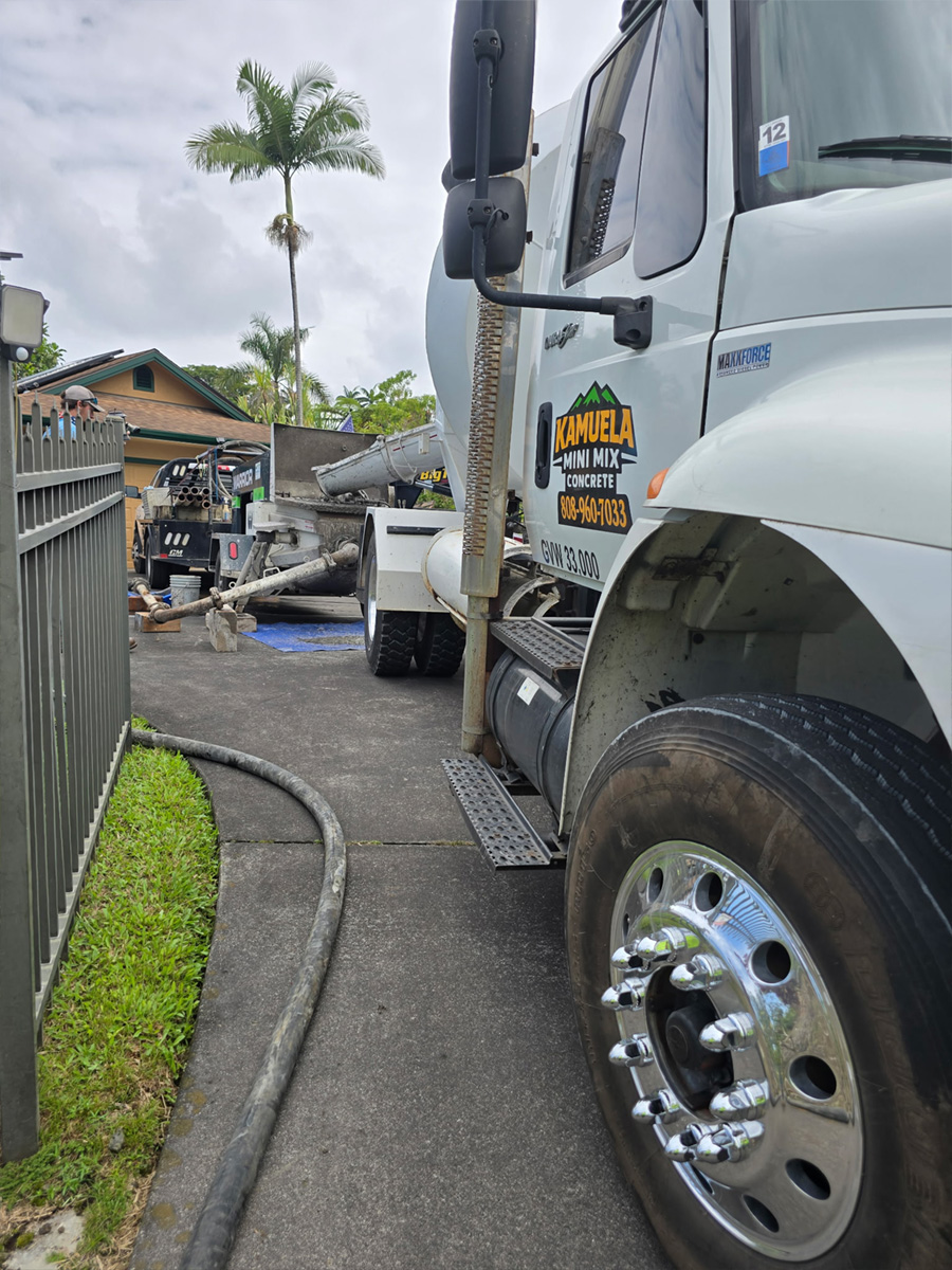 Mini mix truck pumping a residential pour